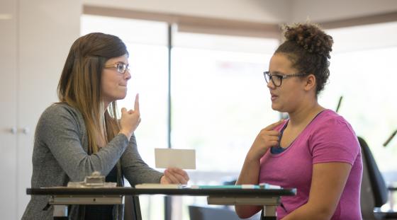 Speech therapist working with an adult patient