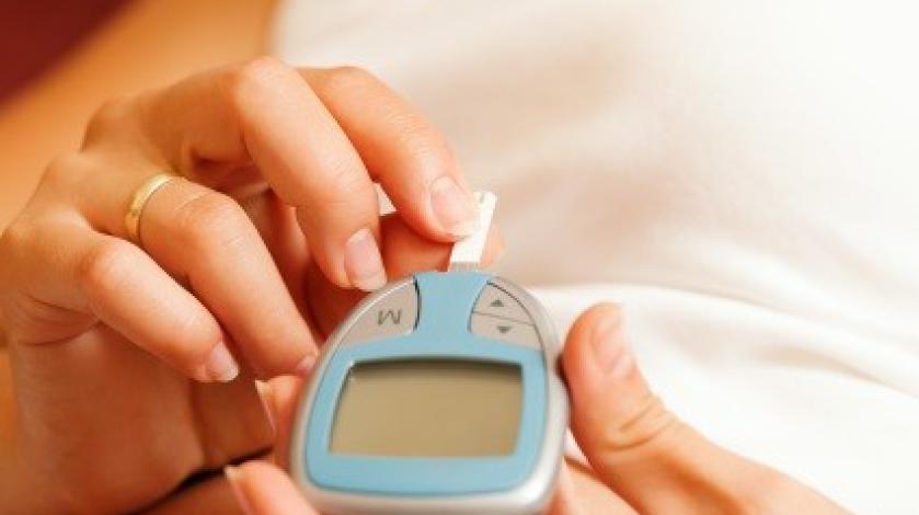 Woman checking her blood sugar levels